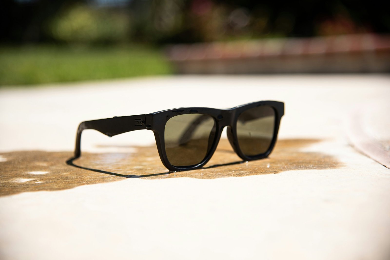 black framed eyeglasses on brown wooden table